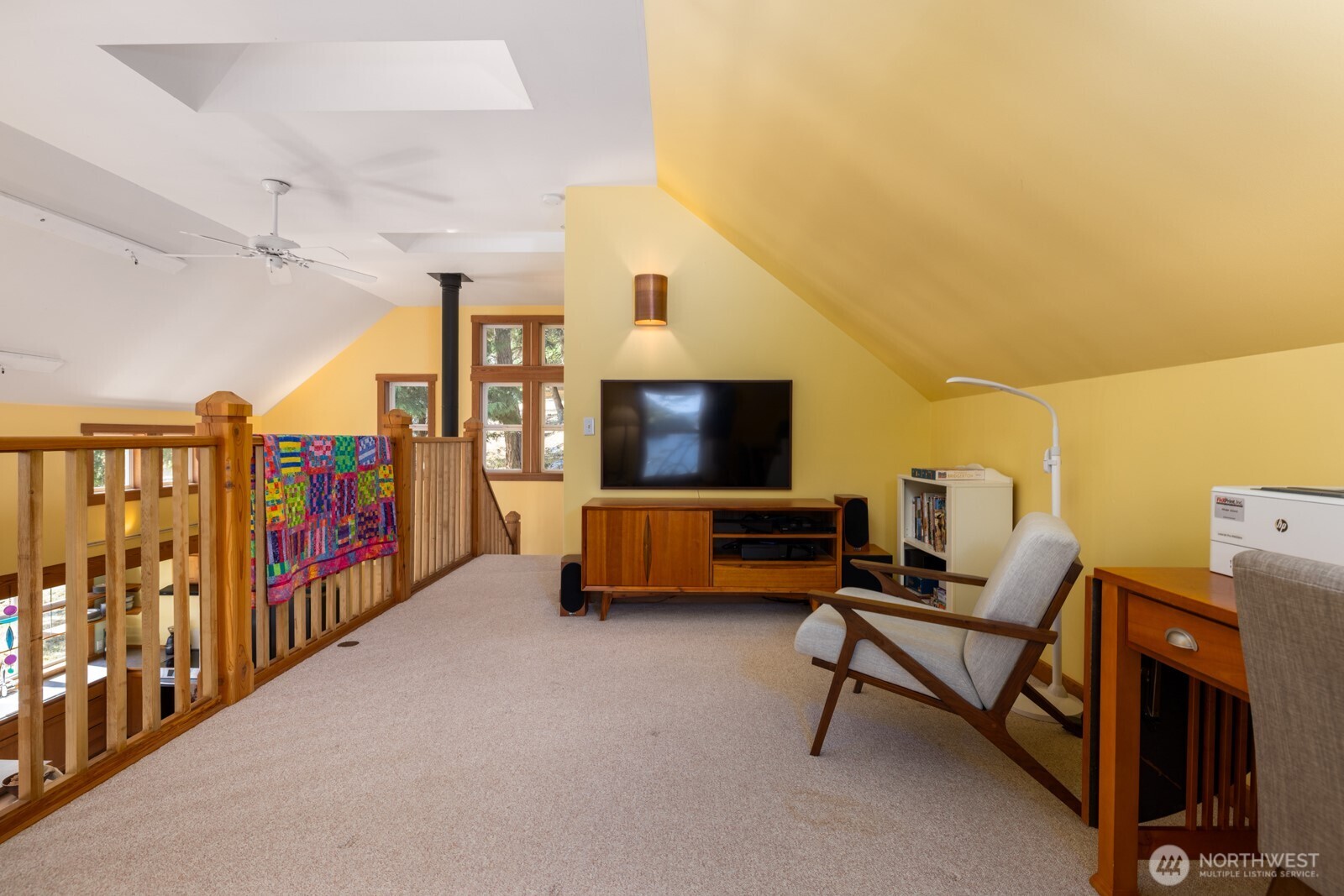 68 Sylvan Cove W Road Decatur Island, WA 98221 - Photo 20 of 35 a living room with furniture and a flat screen tv