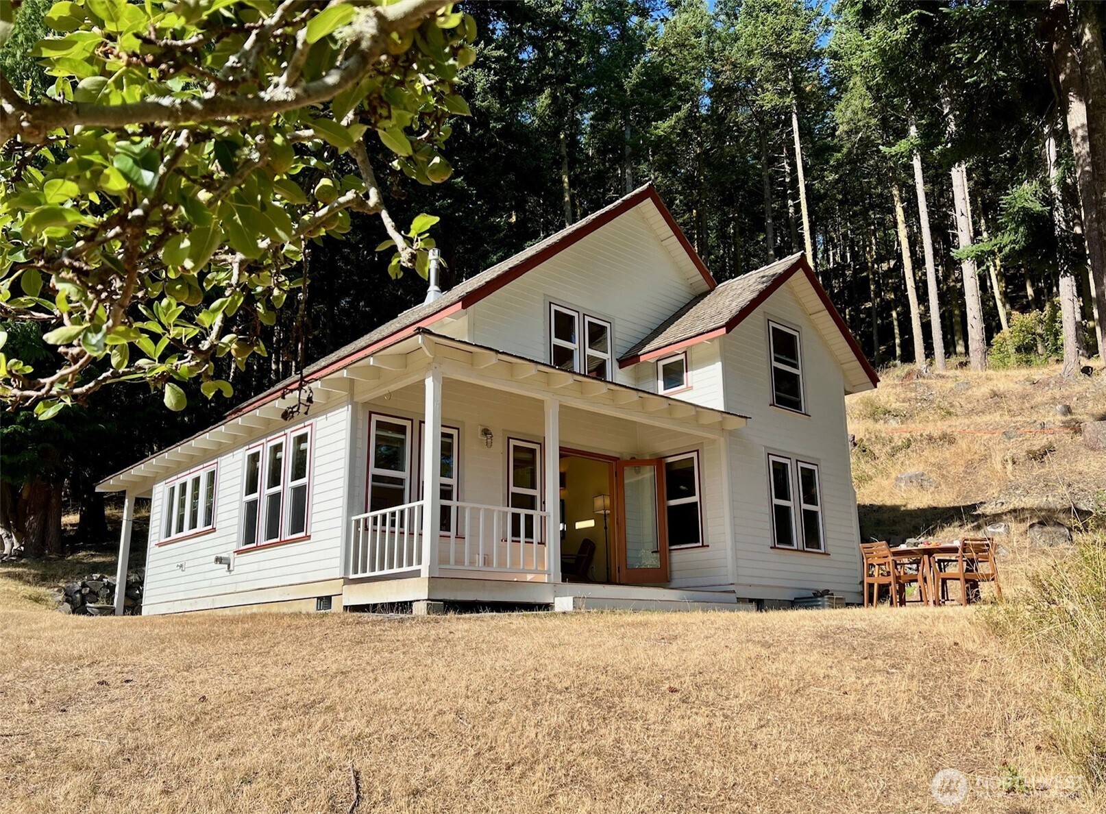 68 Sylvan Cove W Road Decatur Island, WA 98221 - Photo 24 of 35 a view of a house with a yard and sitting area