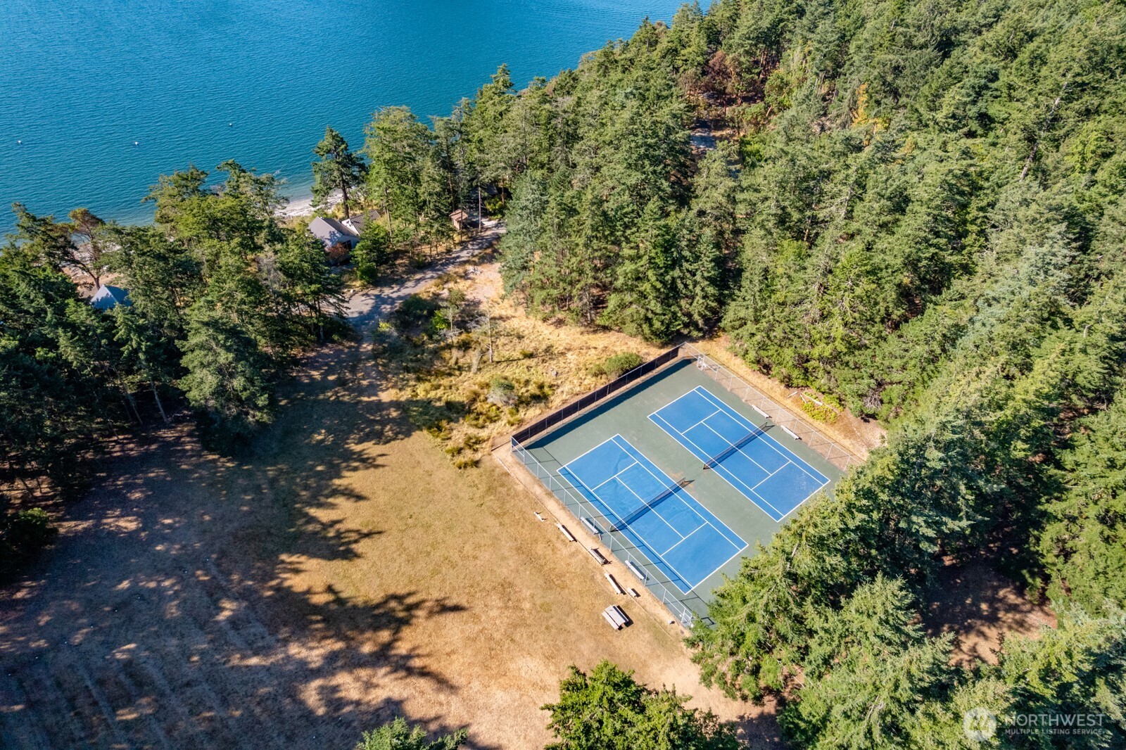 68 Sylvan Cove W Road Decatur Island, WA 98221 - Photo 28 of 35 a view of a house with a yard