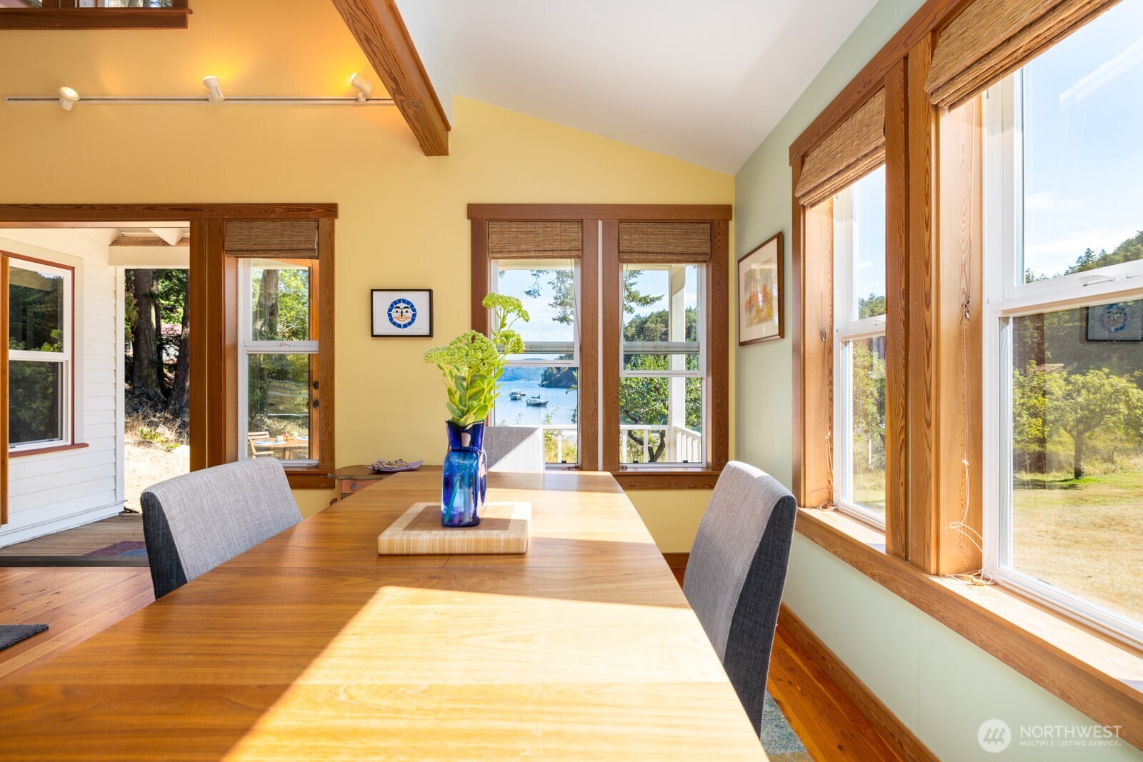 68 Sylvan Cove W Road Decatur Island, WA 98221 - Photo 10 of 35 a view of a living room with furniture and floor to ceiling windows
