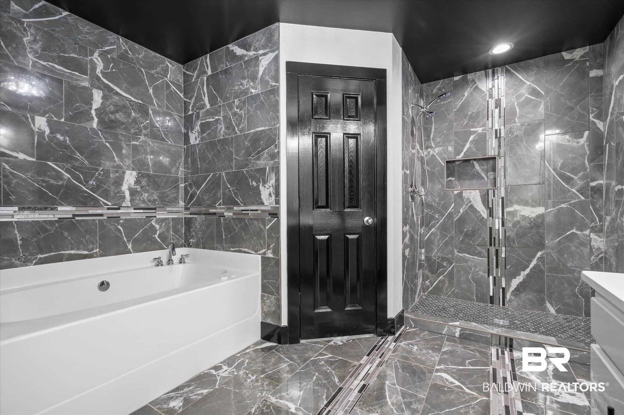 3216 Bay Booster Club Road Theodore, AL 36582 - Photo 14 of 46 Full bathroom with tile walls, a bath, a marble finish shower, dark marble finish floors, and recessed lighting