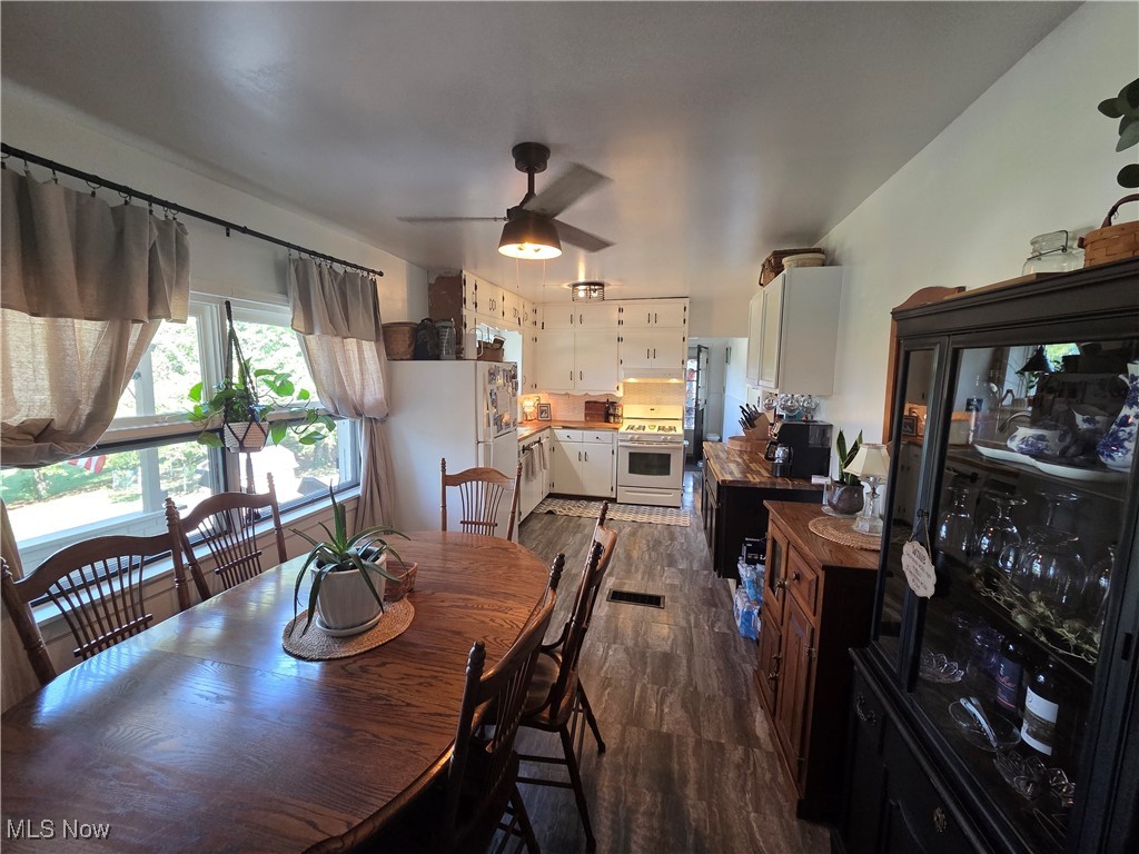 1960 Bellview Road Cambridge, OH 43725 - Photo 16 of 27 Dining room featuring dark wood finished floors and ceiling fan