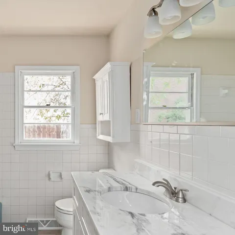 a bathroom with a sink a toilet and a bathtub