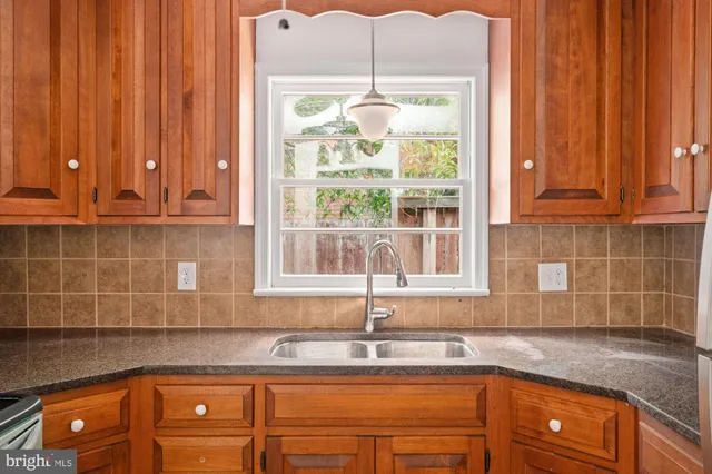 a kitchen that has a sink and a window