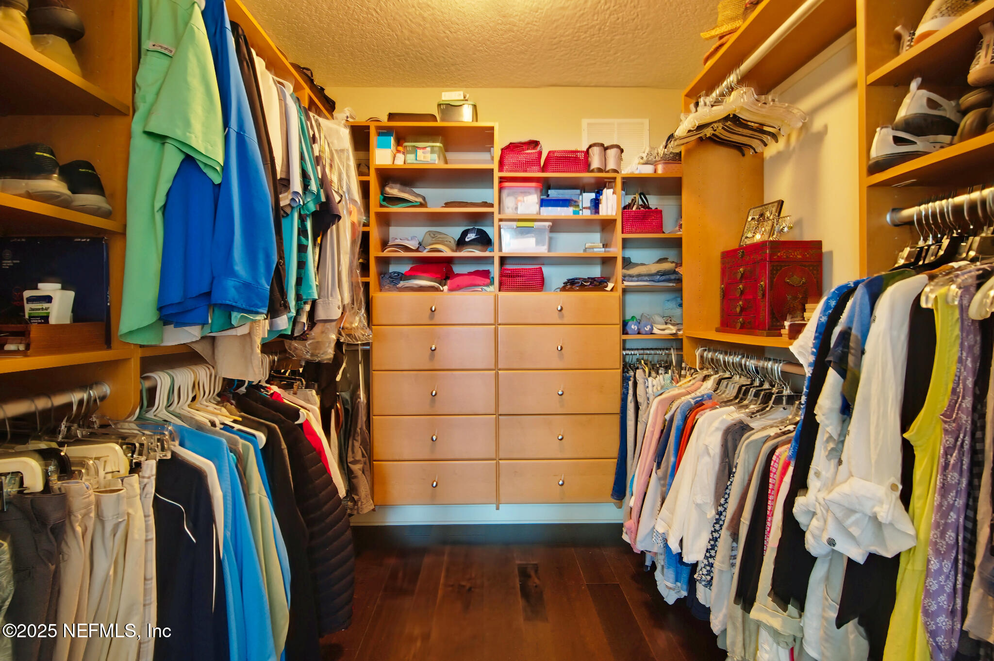 1 Radio Road, Unit 203 St. Augustine, FL 32084 - Photo 24 of 57 a view of walk in closet with clothes and shoes
