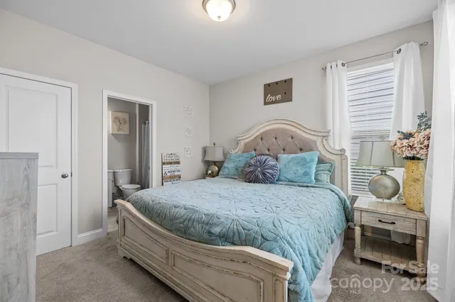 a dining room with furniture a chandelier and wooden floor