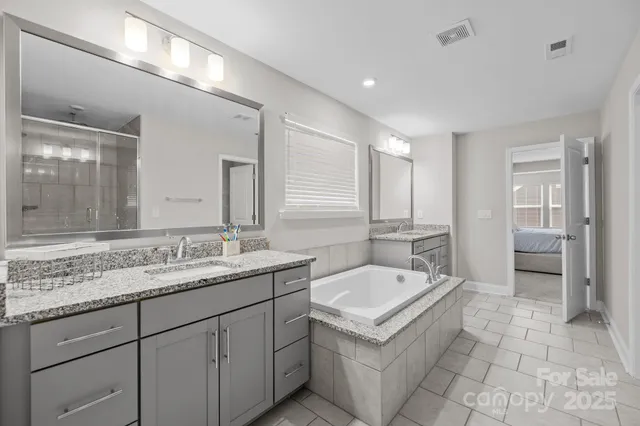 a view of a house with wooden deck patio and outdoor seating