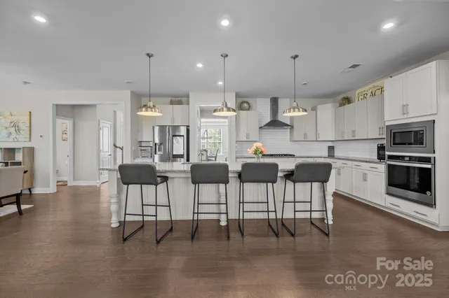 a view of bedroom with furniture and wooden floor