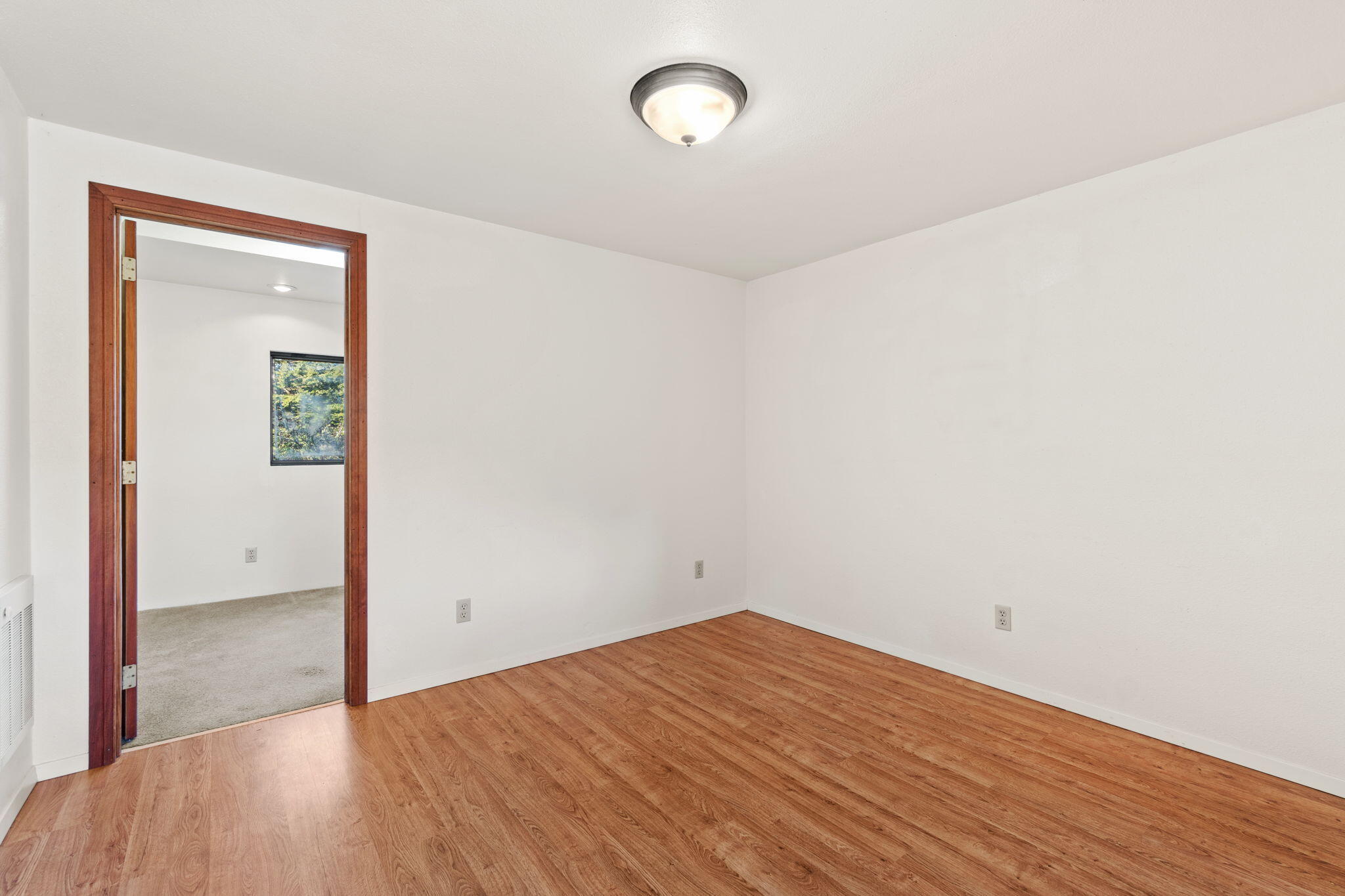 61 Kingston Road Fieldbrook, CA 95519 - Photo 29 of 48 an empty room with wooden floor and windows