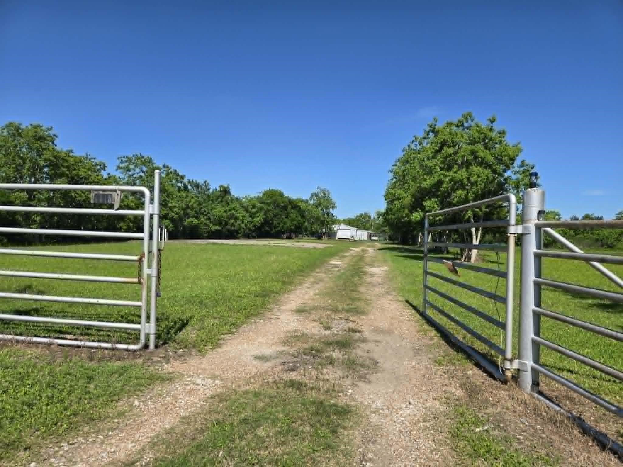 1115 Delany Road La Marque, TX 77568 - Photo 2 of 7 Front Gate - 400 ft driveway per owner