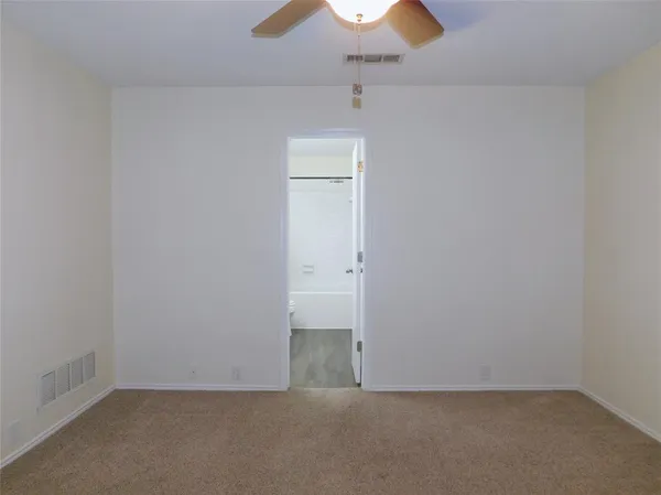 an empty room with a empty space and a window