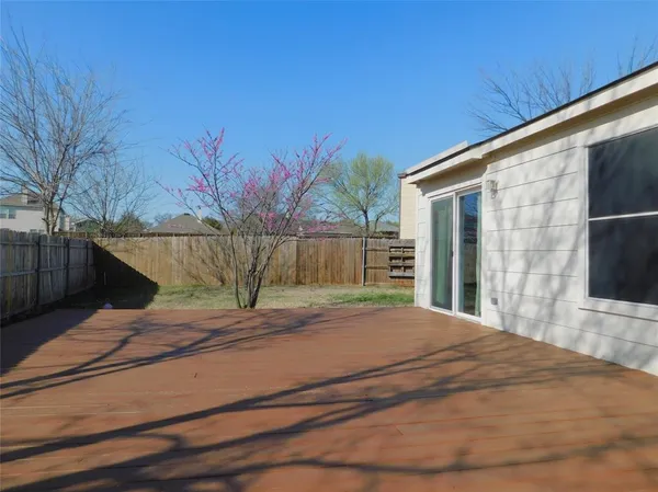 a view of a backyard of the house
