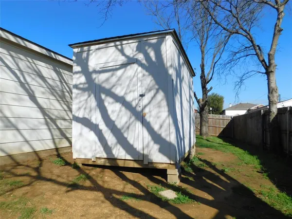 a view of backyard with cabin