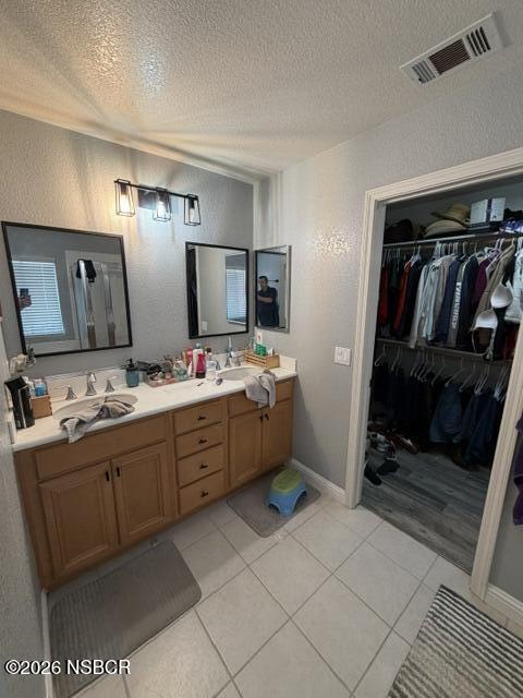 1114 Point Sal Loop Lompoc, CA 93436 - Photo 21 of 25 a bathroom with a sink a mirror and a bathtub