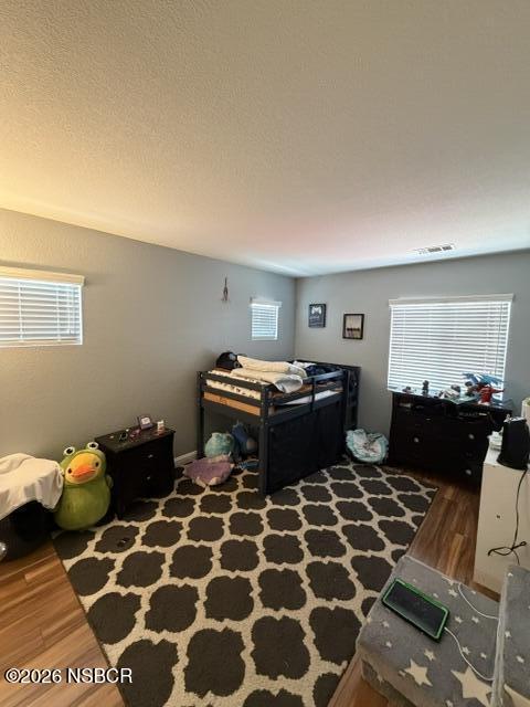 1114 Point Sal Loop Lompoc, CA 93436 - Photo 22 of 25 a bedroom with a bed and a lamp