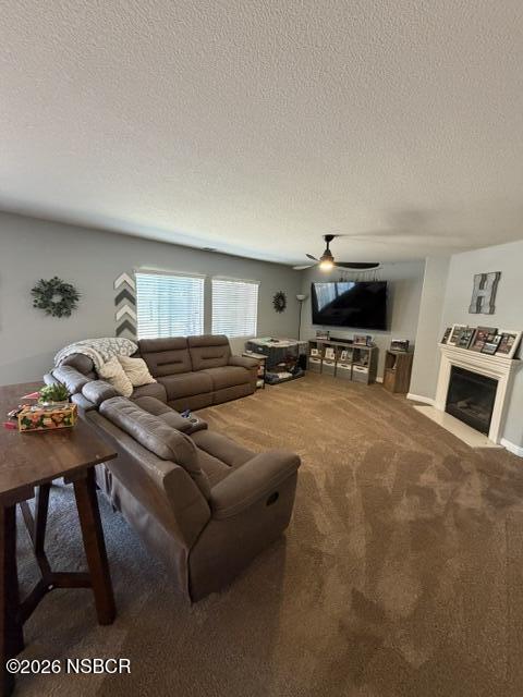 1114 Point Sal Loop Lompoc, CA 93436 - Photo 3 of 25 a living room with furniture a dining table and chairs with a fireplace