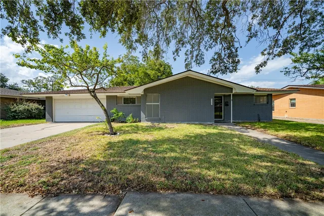 a house with a tree in front of it