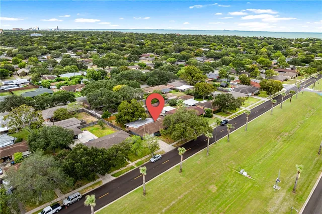 an aerial view of residential houses with outdoor space