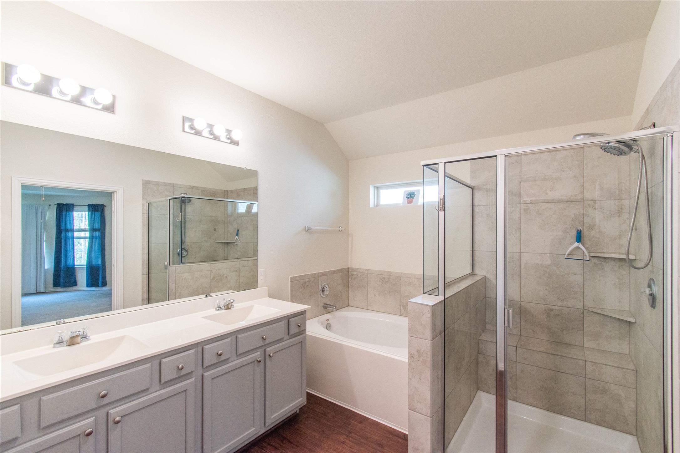 4639 Sequoia Echo Drive Spring, TX 77386 - Photo 16 of 30 a bathroom with a tub shower sink and mirror