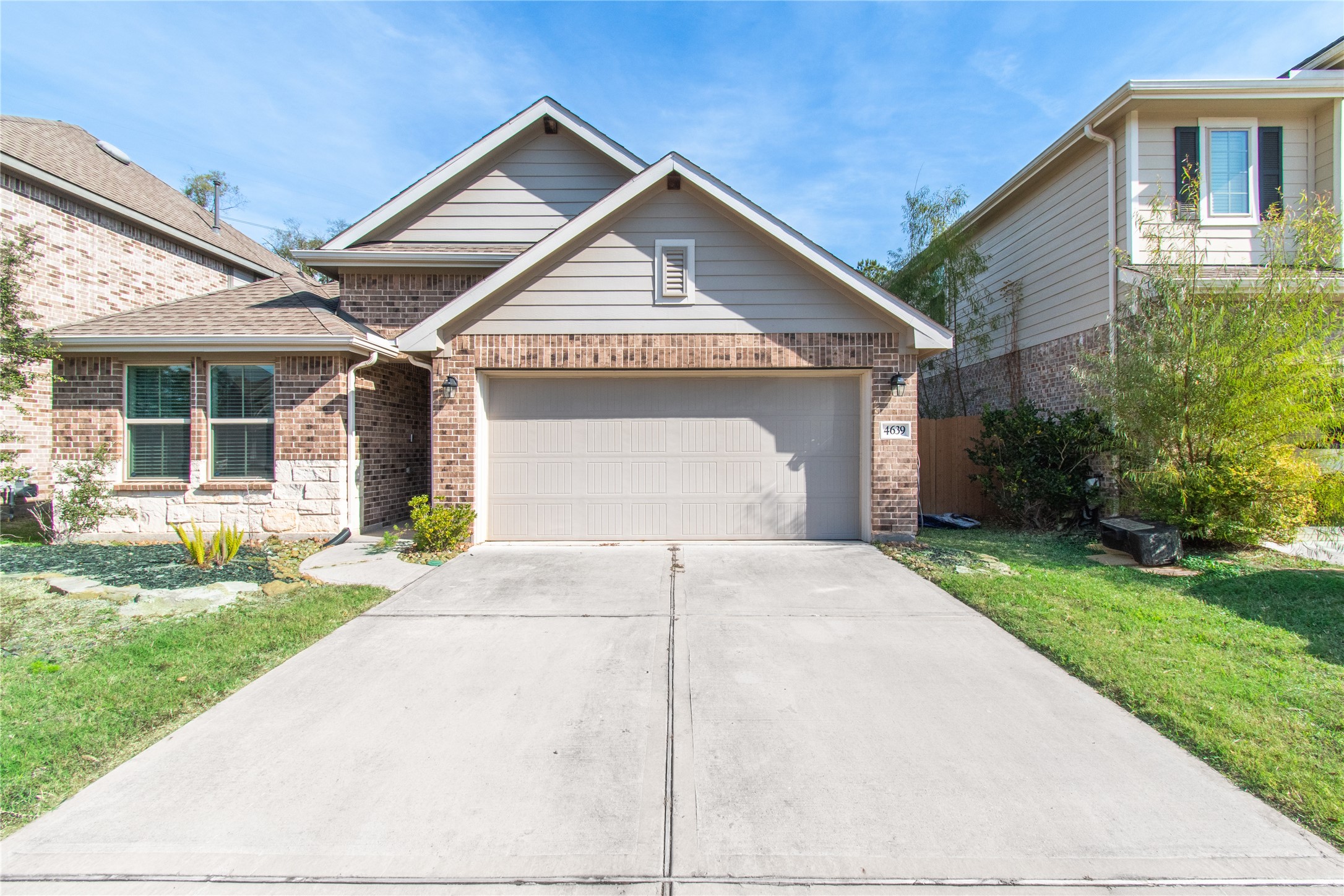 4639 Sequoia Echo Drive Spring, TX 77386 - Photo 2 of 30 a front view of a house with a yard and garage