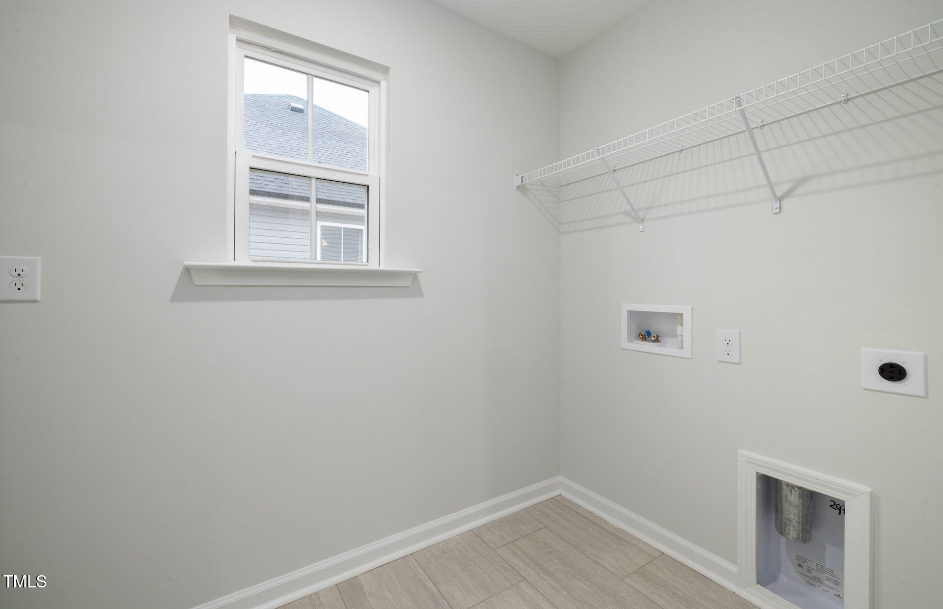 1017 Freestone Road Durham, NC 27703 - Photo 15 of 16 a view of a room that has a window in it