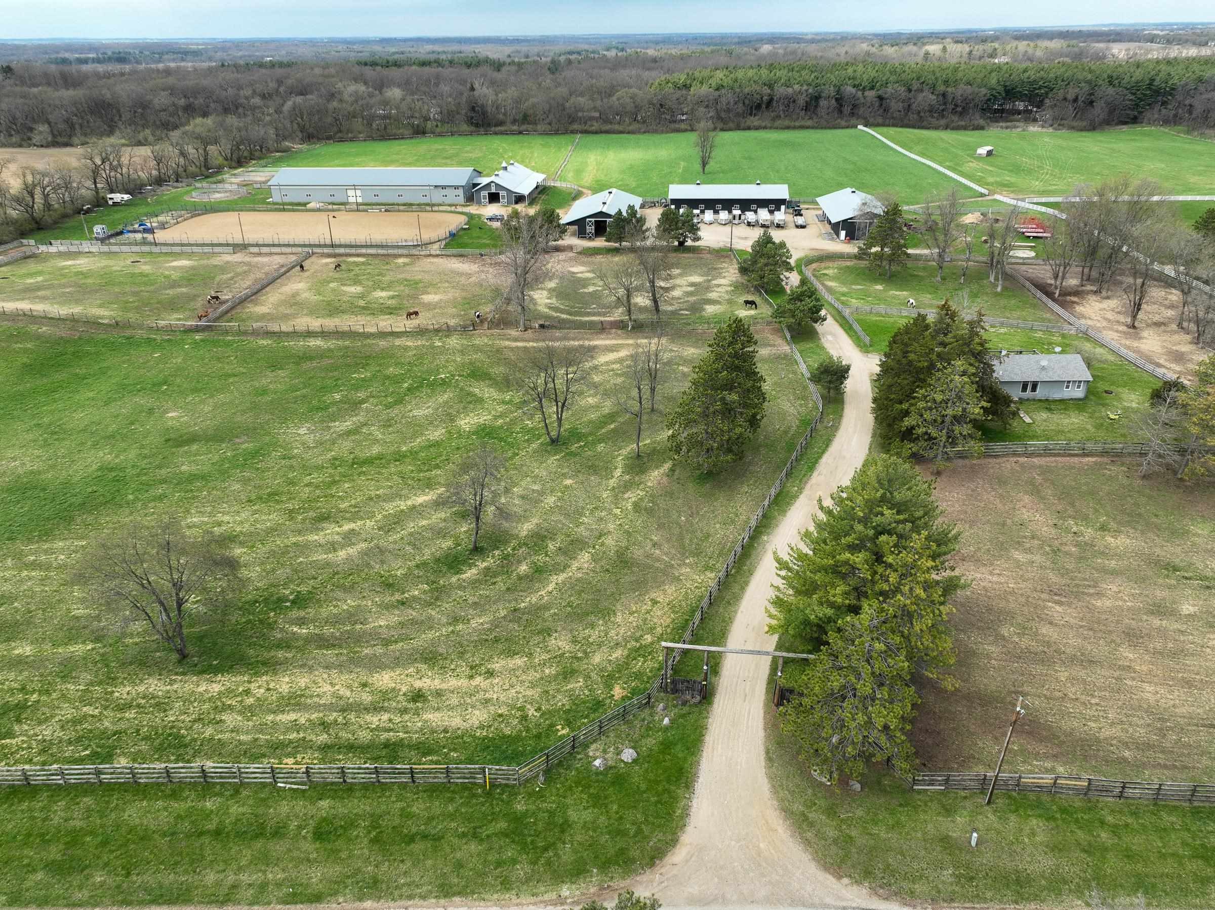 8206 Bull Valley Road Bull Valley, IL 60098 - Photo 2 of 24 an aerial view of a house with outdoor space swimming pool and mountains