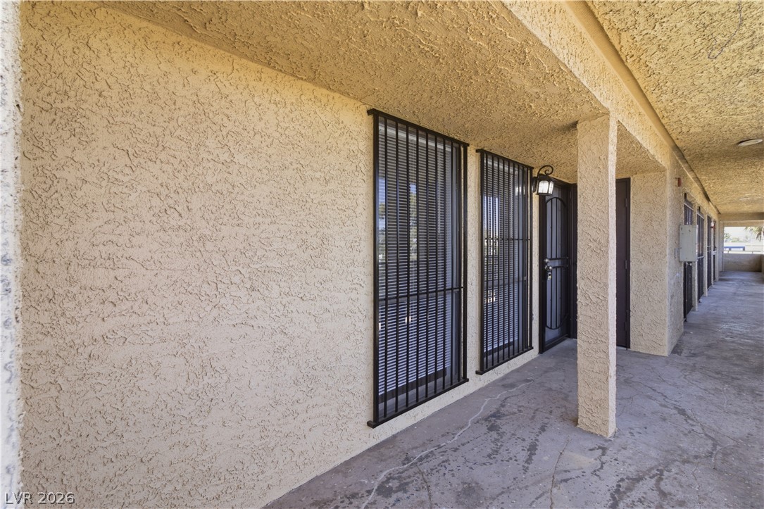 2221 West Bonanza Road, Unit 28 Las Vegas, NV 89106 - Photo 2 of 15 This inviting exterior features durable stucco siding and a covered walkway, offering both style and practicality.