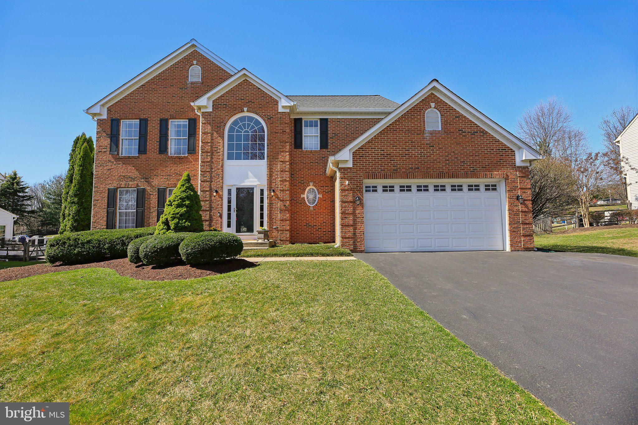 10204 Crosscut Way Damascus, MD 20872 - Photo 1 of 65 a front view of a house with yard and green space