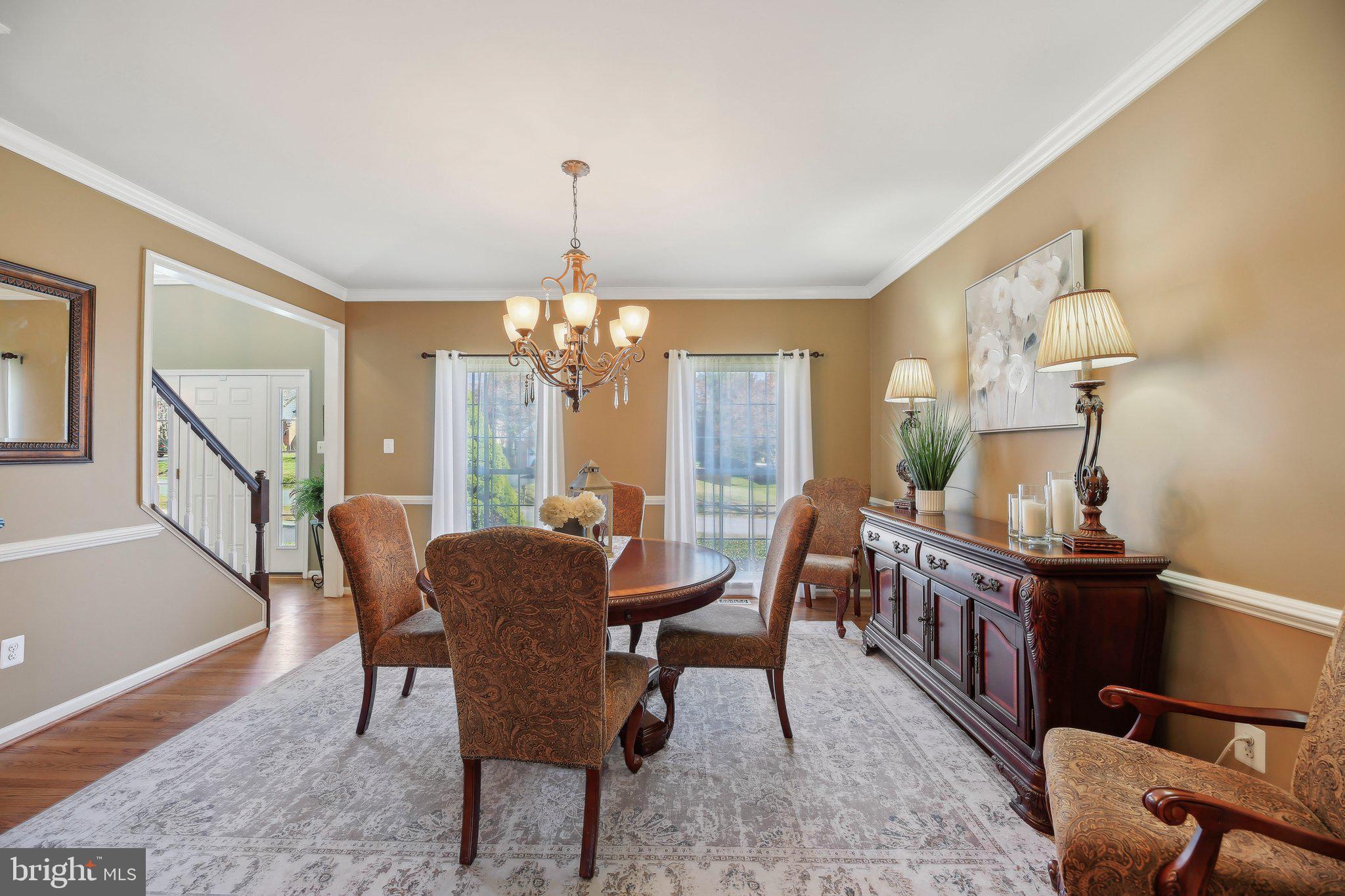 10204 Crosscut Way Damascus, MD 20872 - Photo 11 of 65 a view of a dining room with furniture window and wooden floor