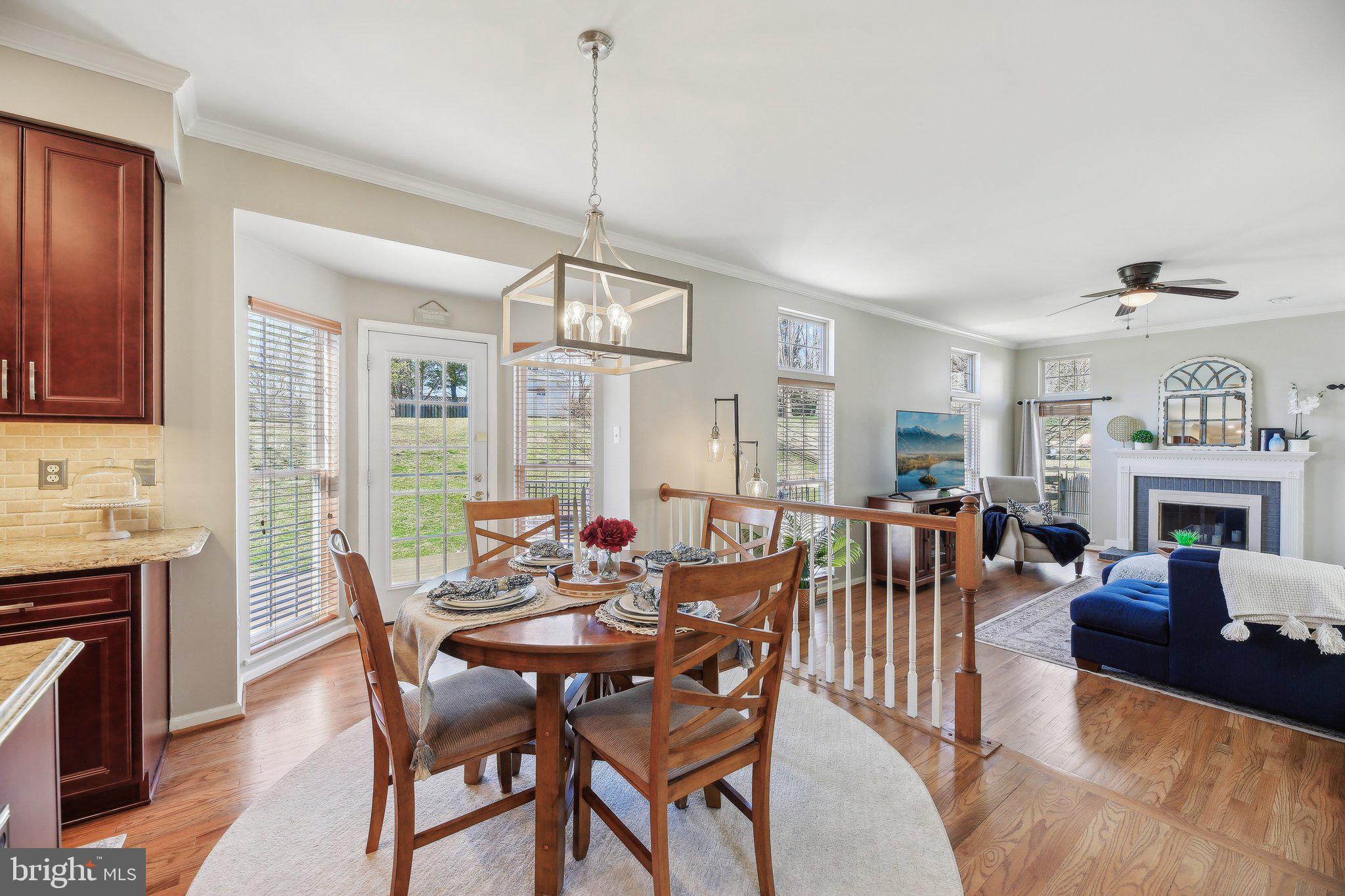 10204 Crosscut Way Damascus, MD 20872 - Photo 17 of 65 a view of a livingroom with furniture window and wooden floor