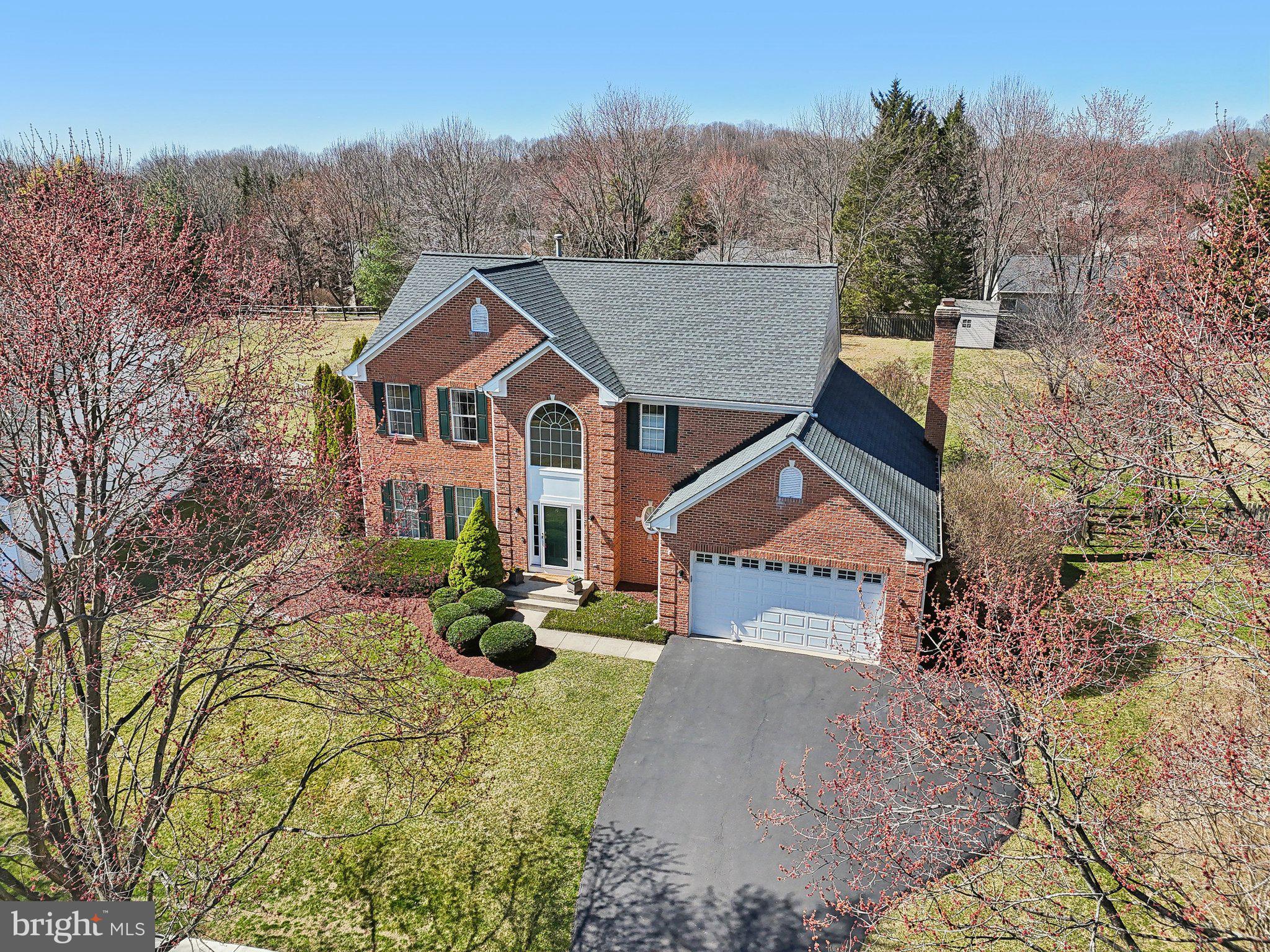 10204 Crosscut Way Damascus, MD 20872 - Photo 2 of 65 a front view of a house with yard