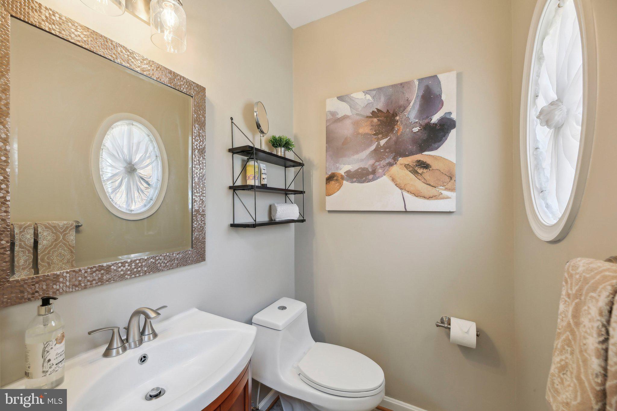10204 Crosscut Way Damascus, MD 20872 - Photo 22 of 65 a bathroom with a toilet and a sink