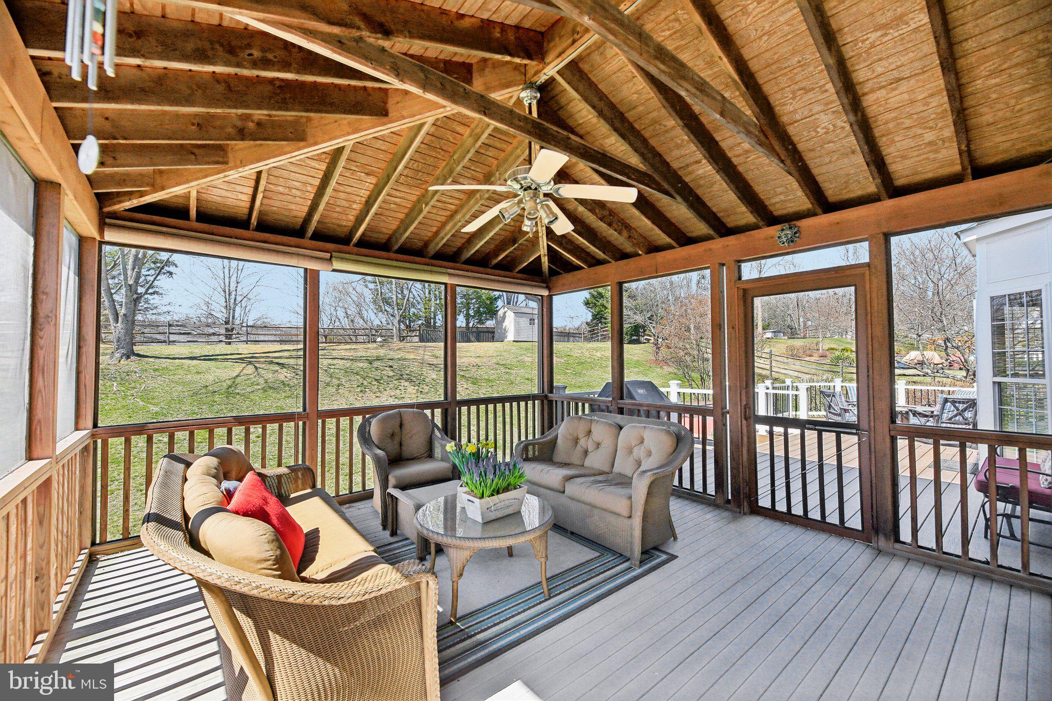 10204 Crosscut Way Damascus, MD 20872 - Photo 24 of 65 a living room with furniture and wooden floor