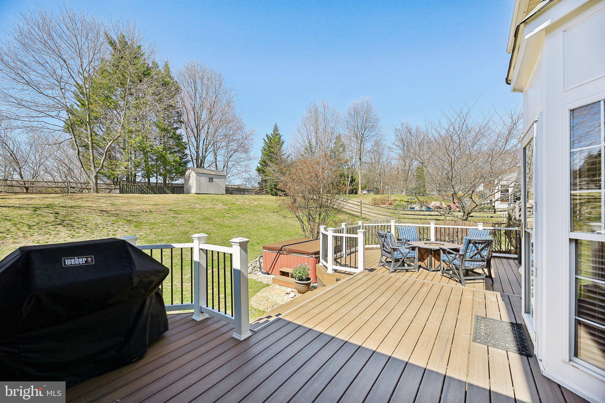 10204 Crosscut Way Damascus, MD 20872 - Photo 26 of 65 a view of a balcony with wooden floor and outdoor seating