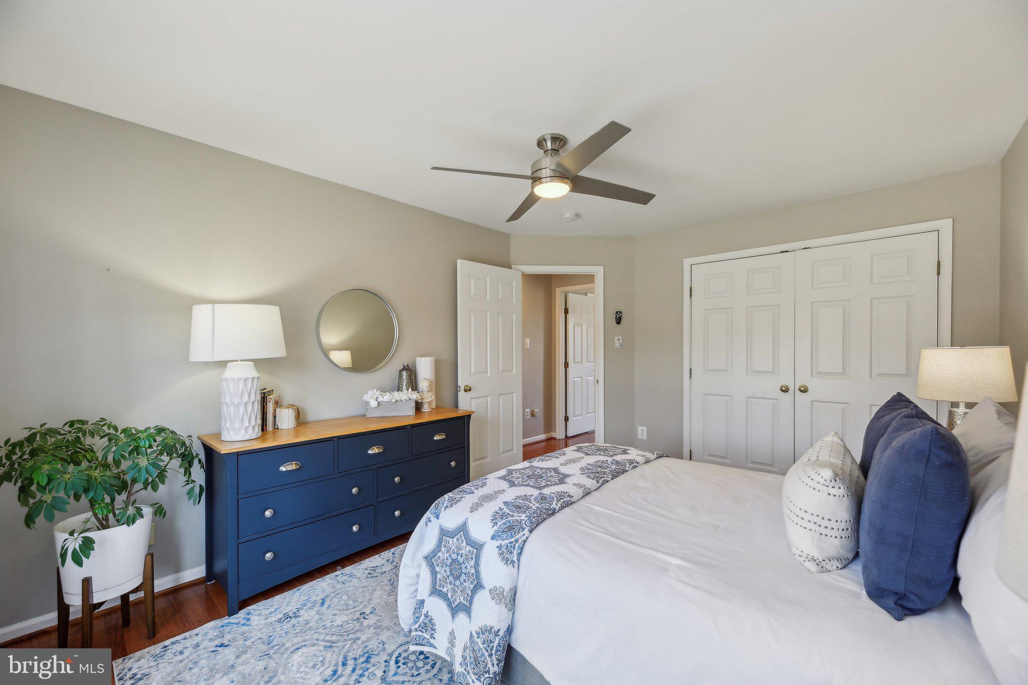 10204 Crosscut Way Damascus, MD 20872 - Photo 33 of 65 a bedroom with a bed and a dresser