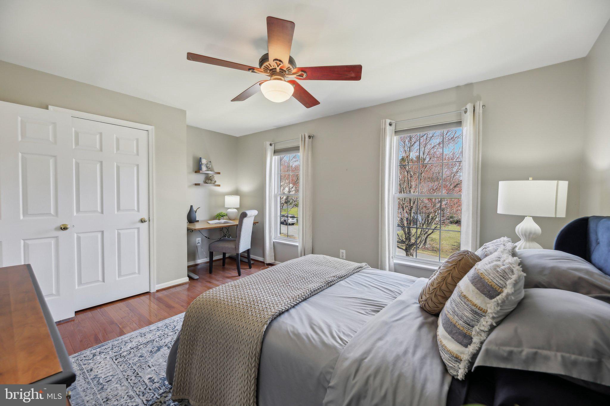 10204 Crosscut Way Damascus, MD 20872 - Photo 35 of 65 a bedroom with a bed and a chandelier