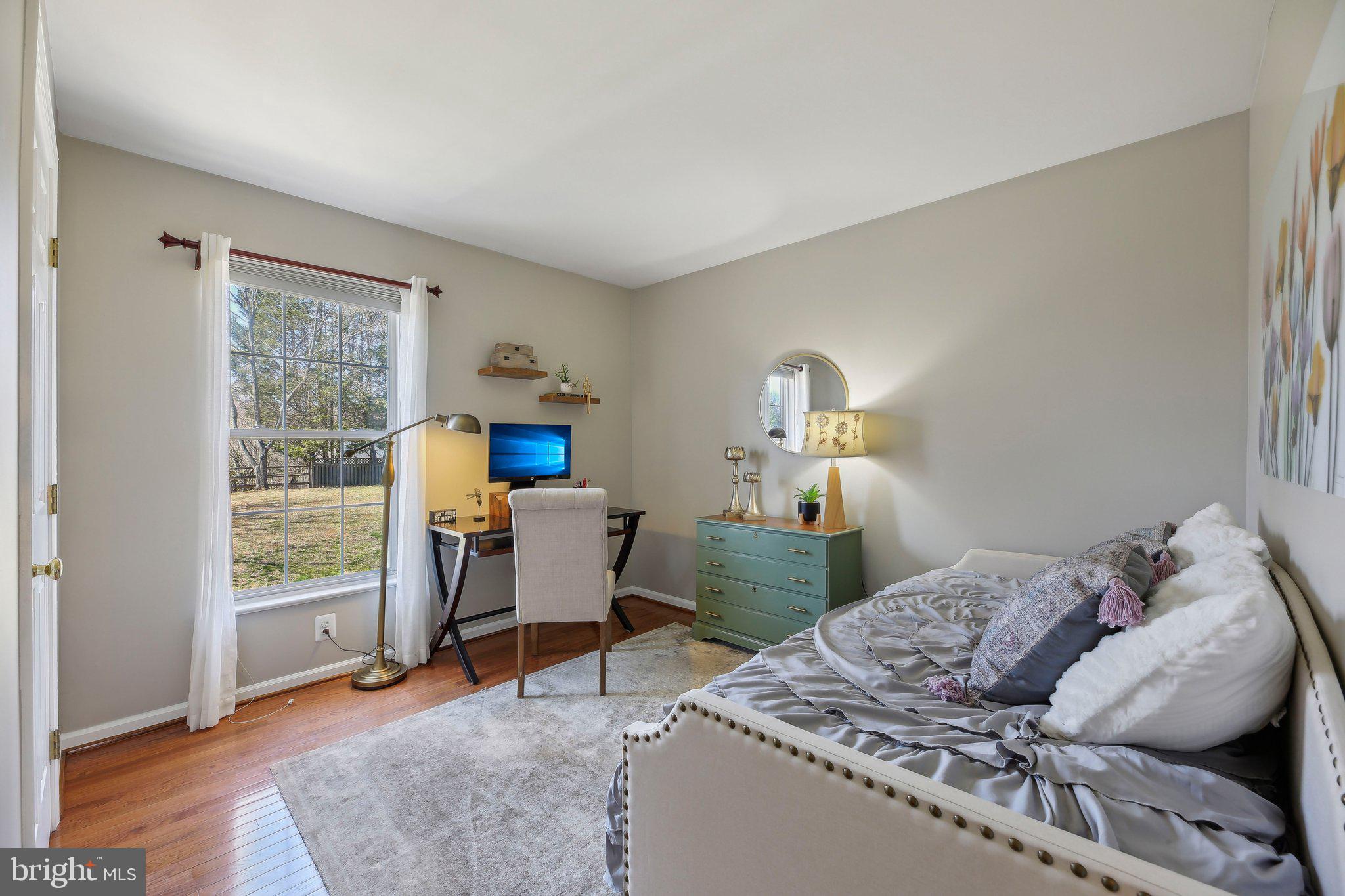 10204 Crosscut Way Damascus, MD 20872 - Photo 37 of 65 a bedroom with a bed and a window