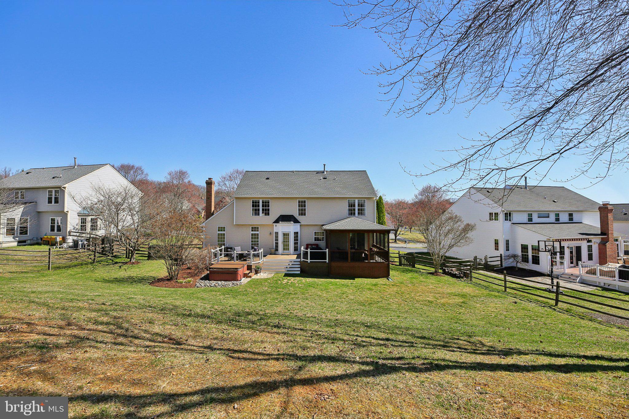 10204 Crosscut Way Damascus, MD 20872 - Photo 48 of 65 a view of a big house with a big yard