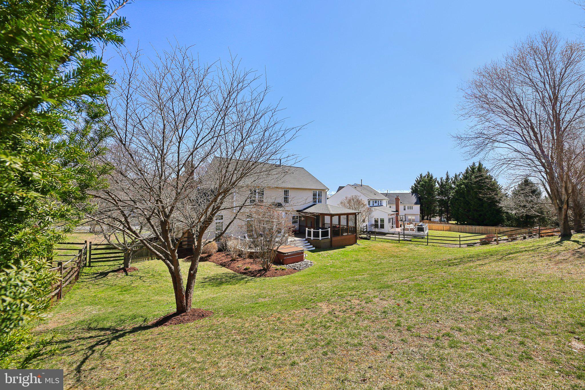 10204 Crosscut Way Damascus, MD 20872 - Photo 49 of 65 a view of a big house with a big yard and large trees