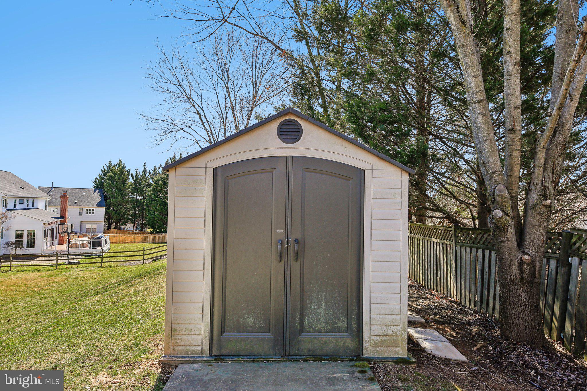 10204 Crosscut Way Damascus, MD 20872 - Photo 50 of 65 a front view of a house with a yard