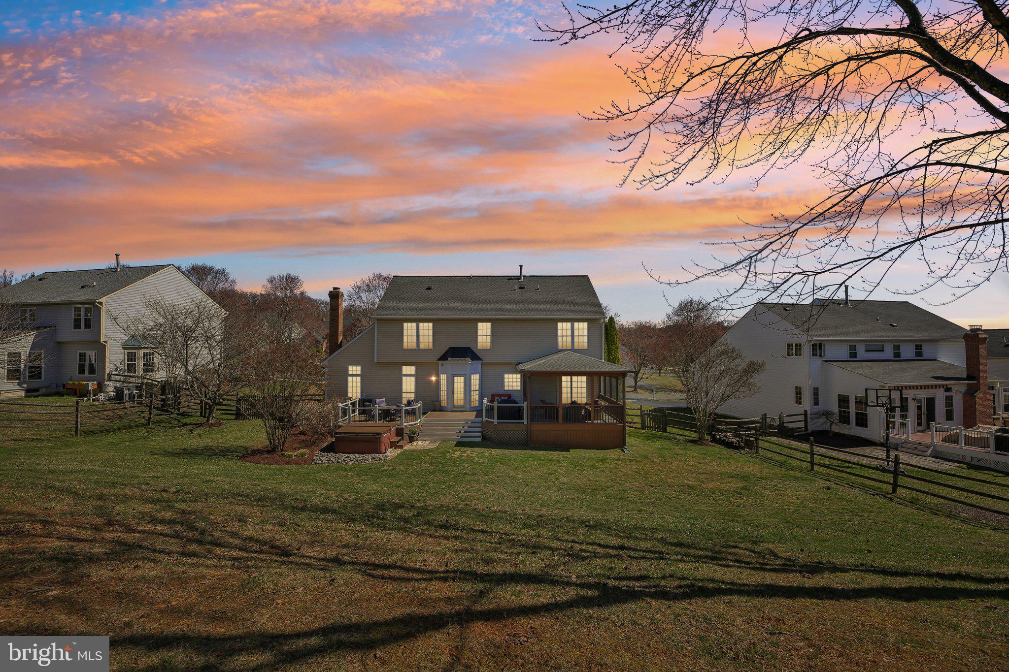 10204 Crosscut Way Damascus, MD 20872 - Photo 5 of 65 a view of a big house with a big yard and large trees