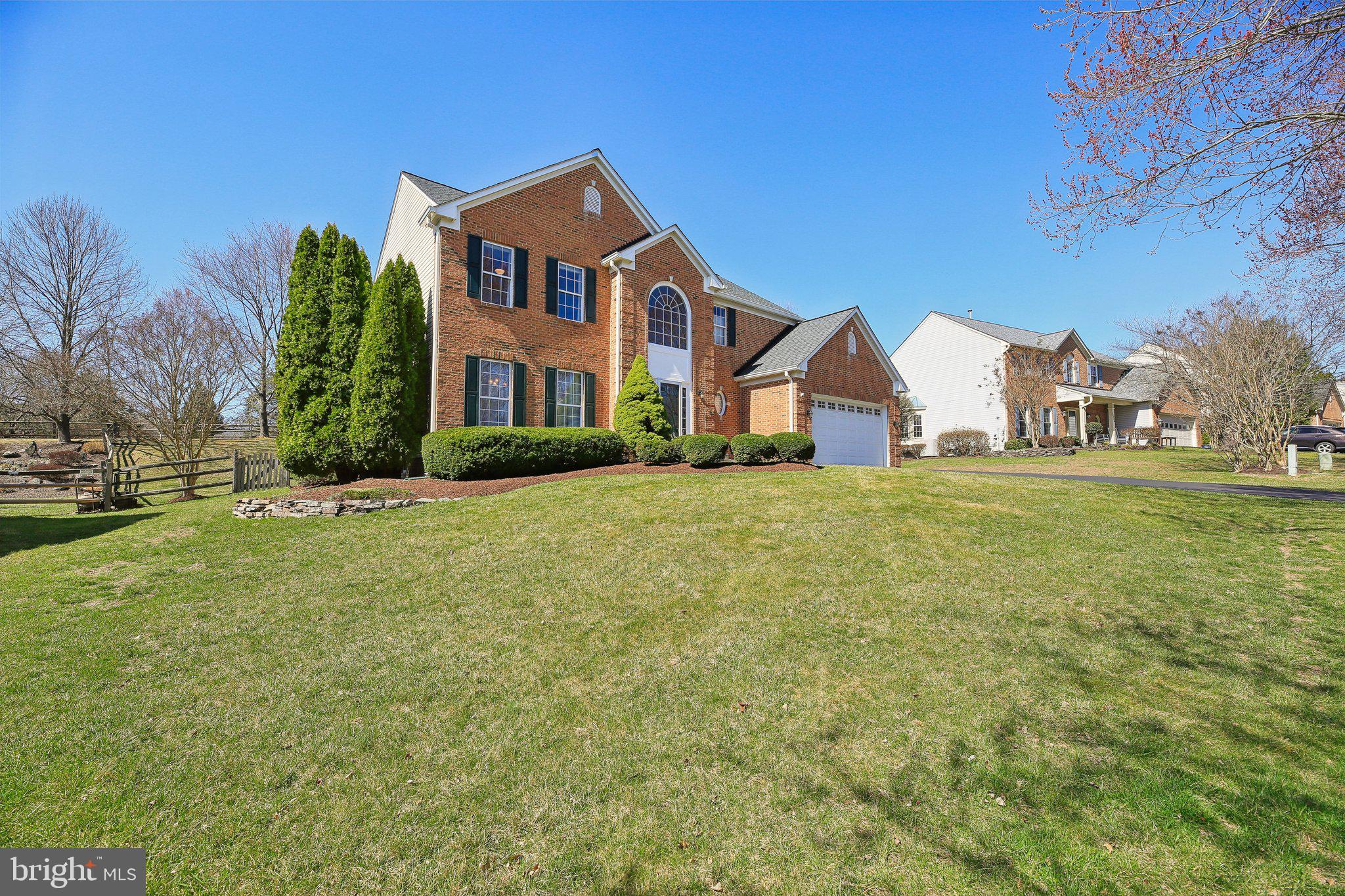 10204 Crosscut Way Damascus, MD 20872 - Photo 7 of 65 a front view of a house with a yard