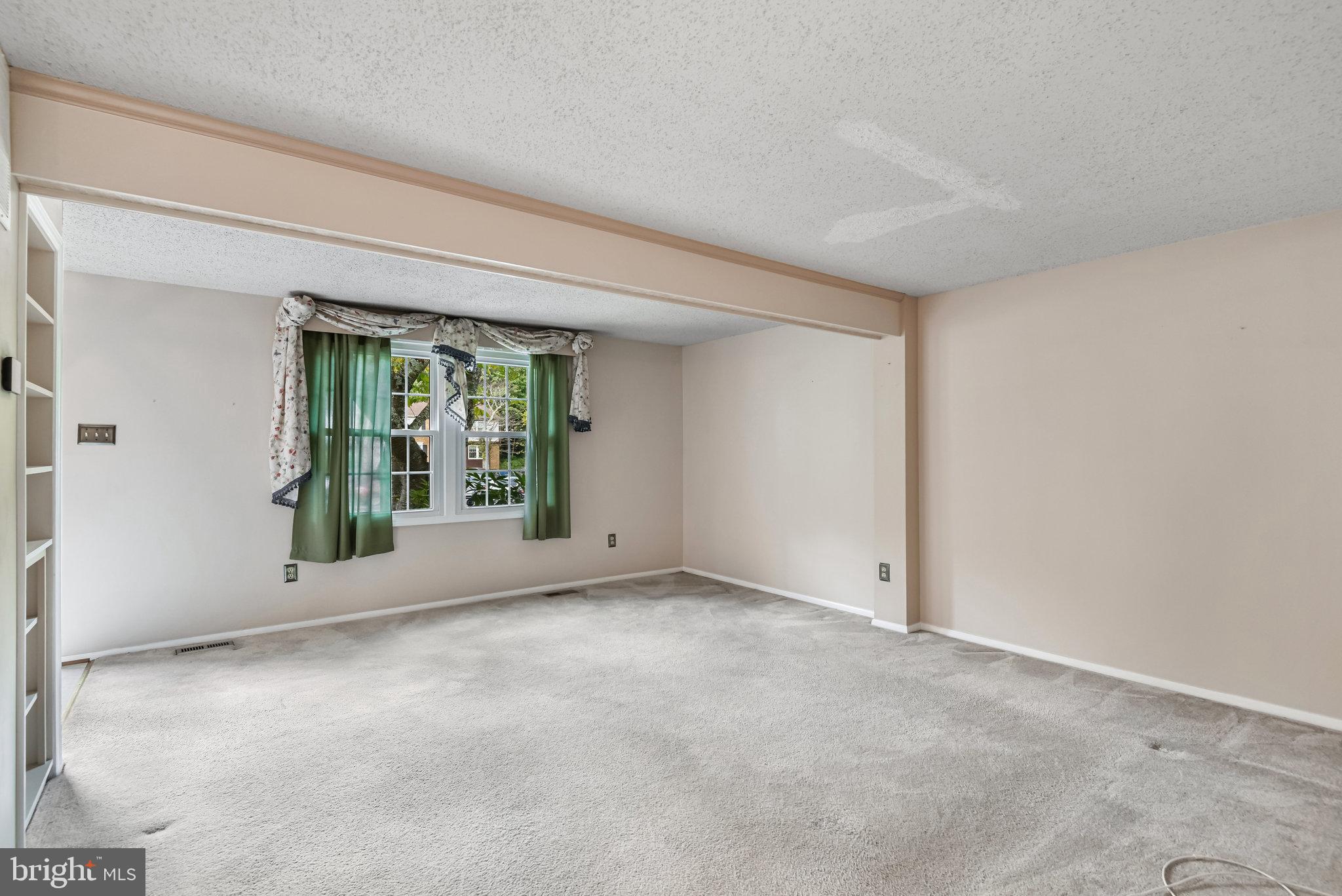 5825 High Bluff Court Burke, VA 22015 - Photo 11 of 52 an empty room with windows