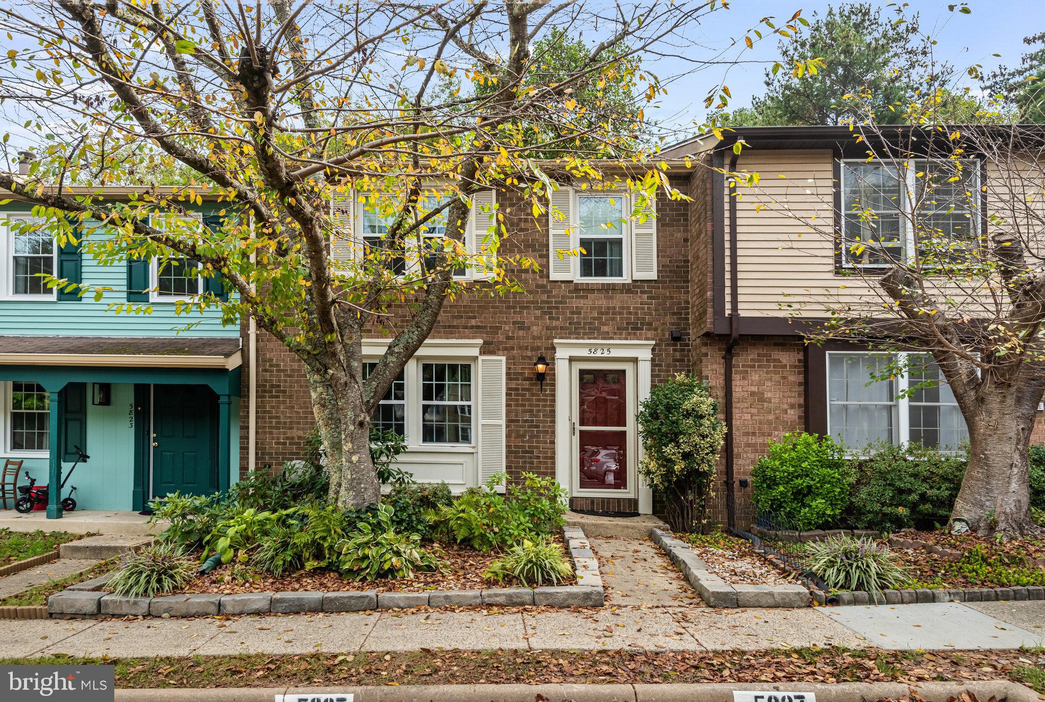 5825 High Bluff Court Burke, VA 22015 - Photo 2 of 52 a front view of a house with garden