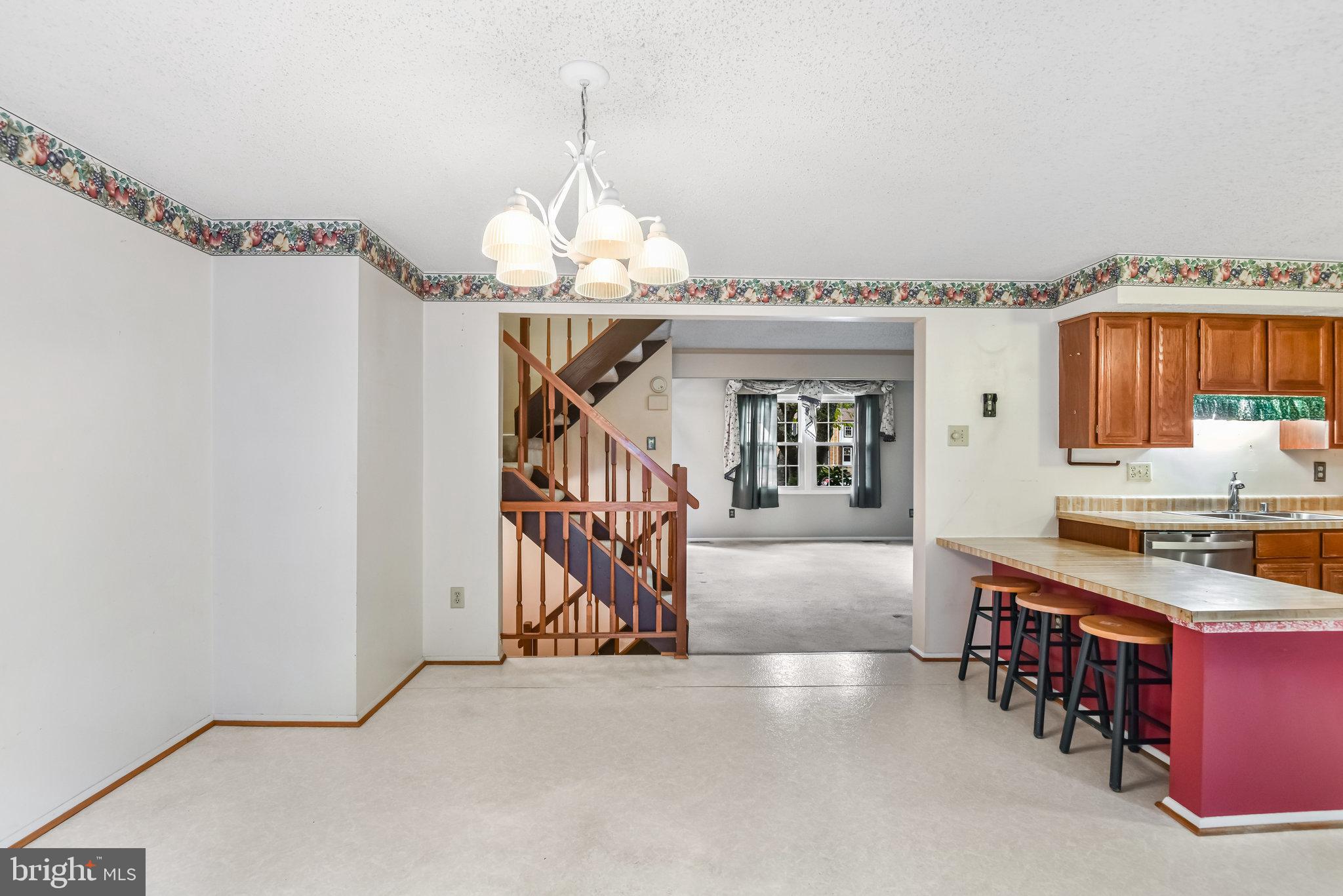 5825 High Bluff Court Burke, VA 22015 - Photo 22 of 52 a view of a livingroom with furniture and chandelier