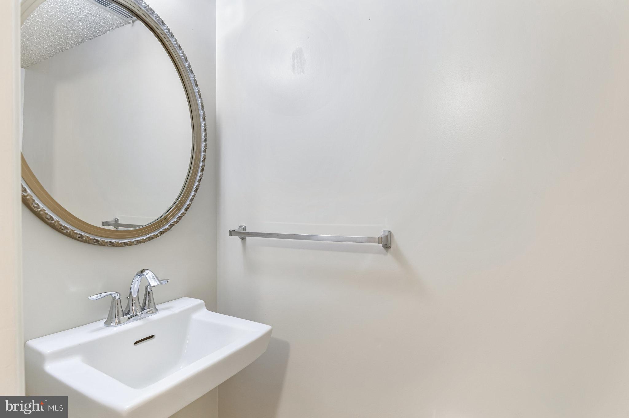 5825 High Bluff Court Burke, VA 22015 - Photo 23 of 52 a bathroom with a sink and a mirror