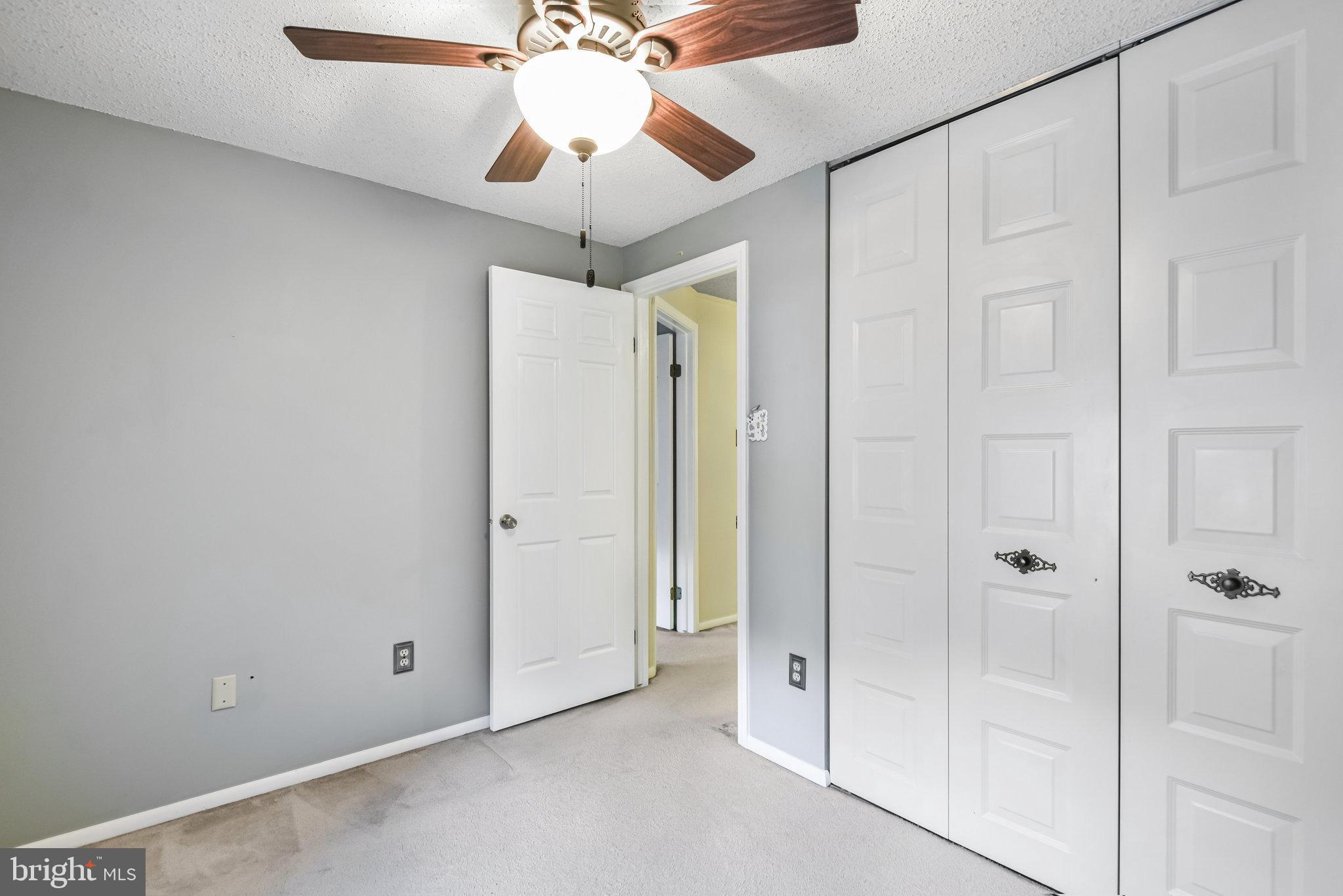5825 High Bluff Court Burke, VA 22015 - Photo 26 of 52 en view of a chandelier fan and entryway