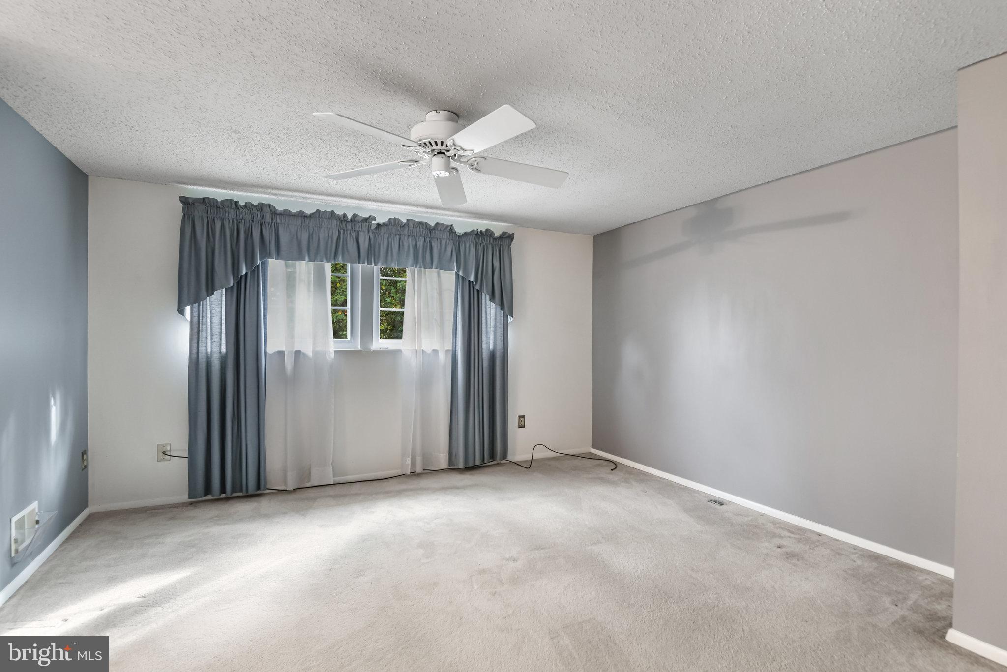 5825 High Bluff Court Burke, VA 22015 - Photo 29 of 52 a view of an empty room with a window