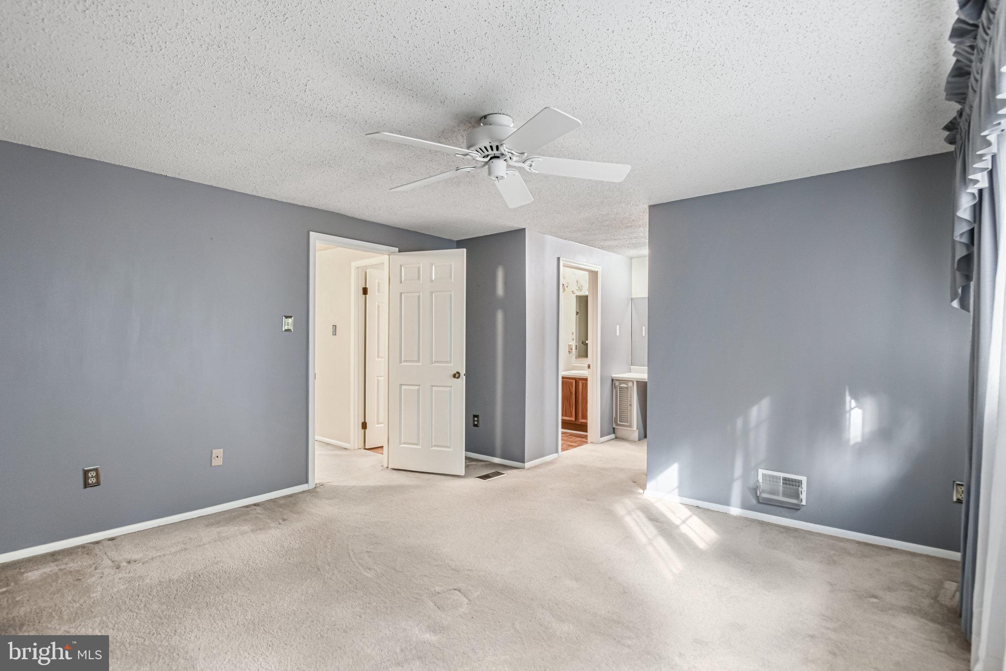 5825 High Bluff Court Burke, VA 22015 - Photo 30 of 52 a view of a livingroom with a ceiling fan window and ceiling fan