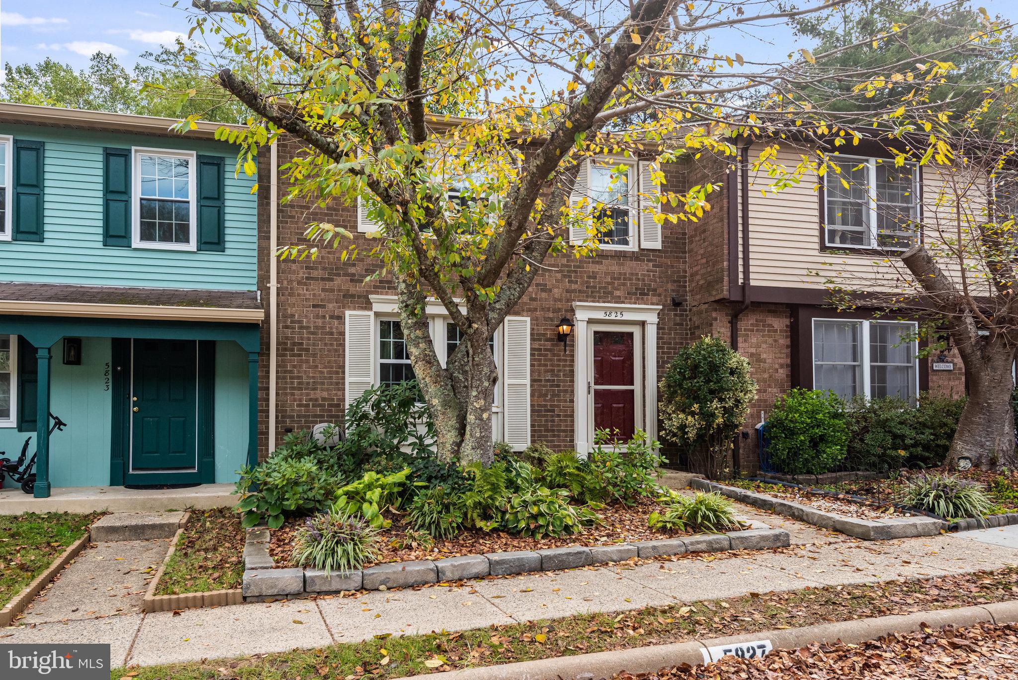 5825 High Bluff Court Burke, VA 22015 - Photo 3 of 52 a front view of a house with garden